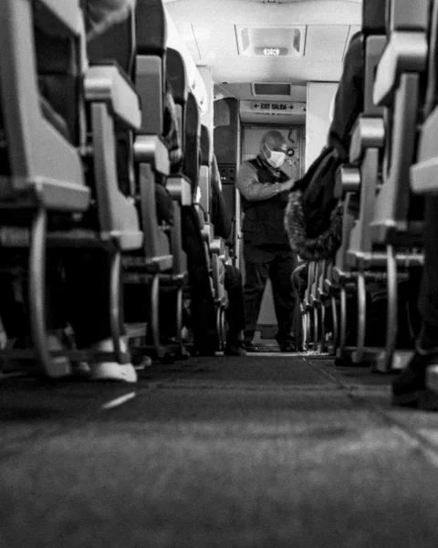 Standing in the aisle the second it lands